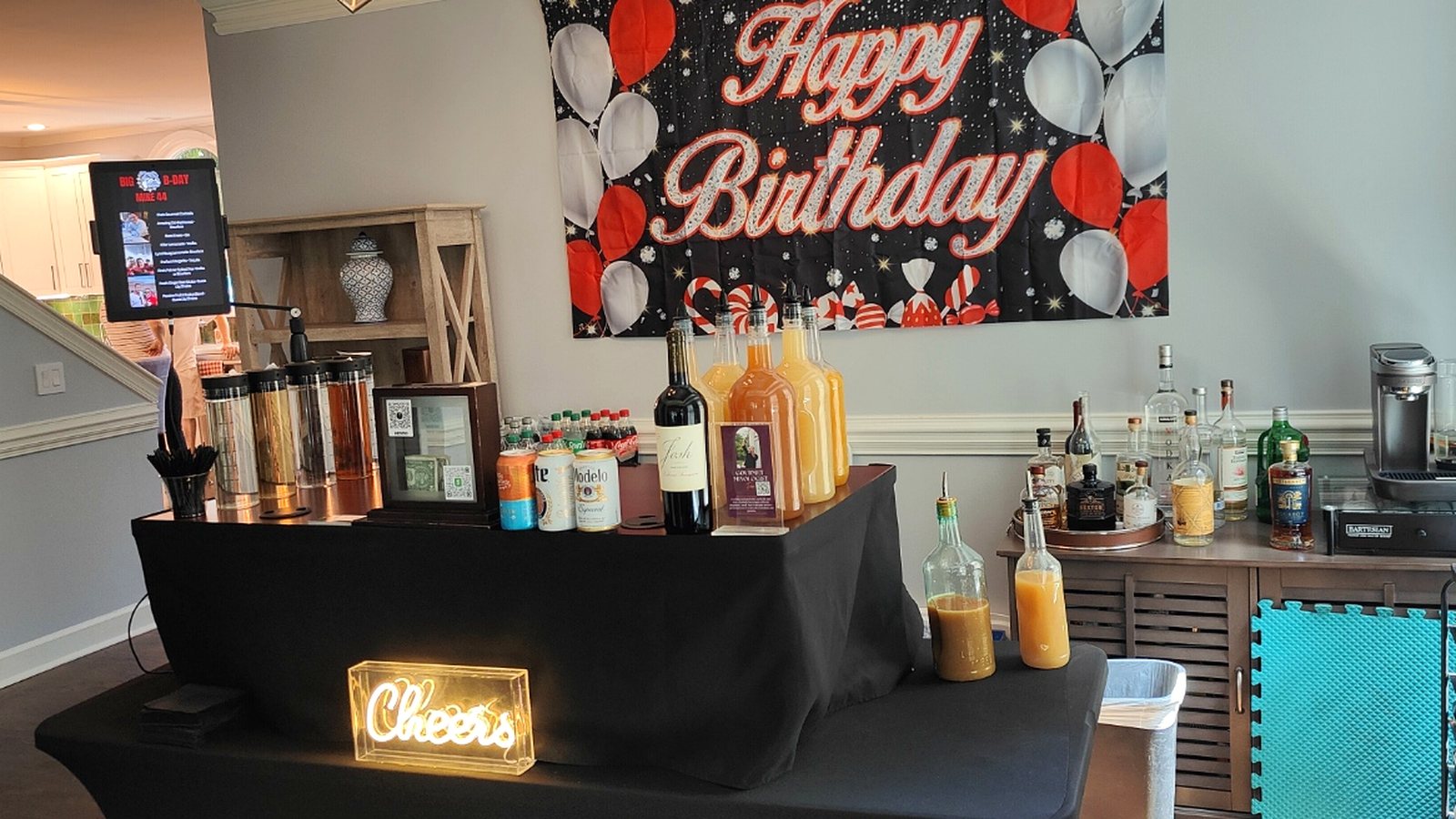A complete birthday party bar setup with handcrafted mixers